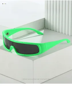 Detail of neon green matte cycling sunglasses with wrap-around frames on white pedestal