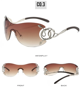 Detailed view of oversized Y2K sunglasses with snake-shaped metal temples and rhinestones