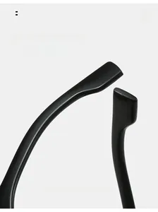 Detail of curved glossy black temple arm for ergonomic and comfortable sporty fit