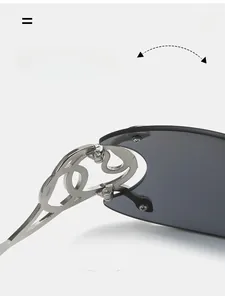 Close-up of durable silver metal hinge with hollow curved design on Y2K shield sunglasses