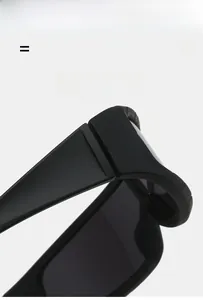 Detail view of lightweight, flexible hinges on matte black cycling sports sunglasses