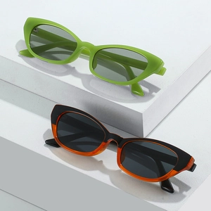 Modern cat-eye sunglasses with wide temples in neon green and black-orange frames