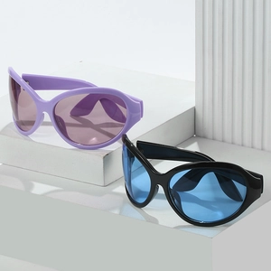 Oversized retro hip-hop sunglasses with purple and black frames on geometric display