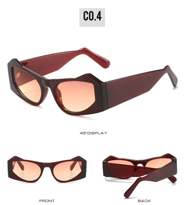 Detail view of burgundy cat-eye sunglasses with geometric frames and gradient lenses