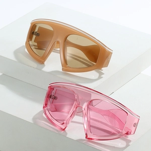 Oversized wrap-around sports sunglasses in khaki and transparent pink on display stands