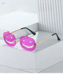 Macro detail of rose purple pumpkin lenses with cut-out smile and gold metal temples