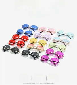 Multiple colors of festive pumpkin-shaped hollow sunglasses displayed for Halloween style
