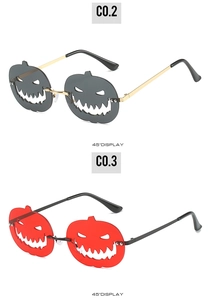 Detail showing pumpkin shaped Halloween sunglasses in smoke grey and vibrant red lenses