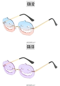 Detail view of pumpkin shaped rimless sunglasses in gradient pink and purple lens