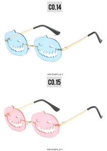 Detailed 45-degree view of novelty pumpkin-shaped rimless sunglasses for Halloween