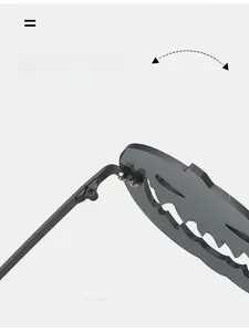Detail of durable black metal hinge and flame-edged gray lenses on pumpkin sunglasses