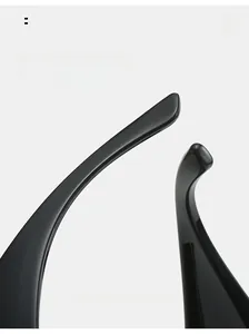 Detailed macro view of the curved mirror legs on sleek black sports sunglasses