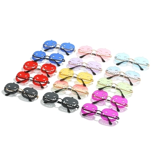 Halloween pumpkin silhouette sunglasses in various vibrant colors for festive party costumes