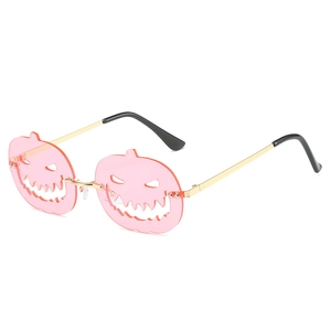 Halloween pumpkin sunglasses with pink lenses and golden metal frames for festival costumes