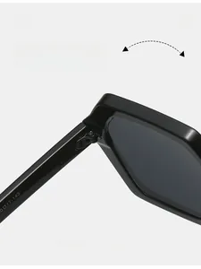Detail of durable texture hinge on black oversized sunglasses with smooth folding mechanism