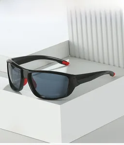 Detail of black cycling sunglasses with blue lenses and red non-slip nose pads