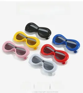 Flat lay of Y2K wrap-around sunglasses in multiple colors with thick oval frames