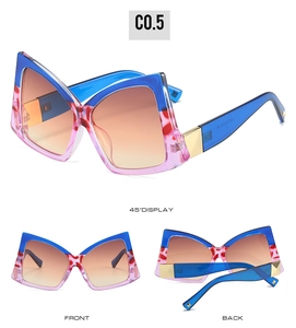 Détails des lunettes de soleil nœud papillon avec monture bleu rose et accents dorés