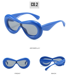 Three-angle views of royal blue Y2K wrap-around sunglasses with bold frames and gray lenses