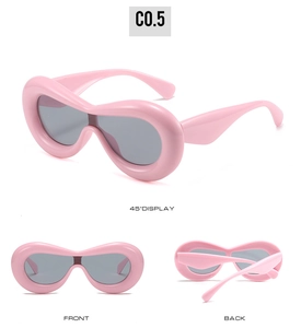 Three perspectives of pink Y2K chunky bubble frame sunglasses with dark grey lenses