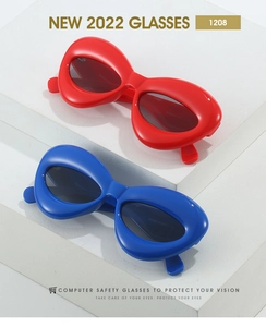Detail of trendy puffy cat eye sunglasses in bold red and blue with thick frames