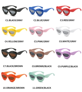 Grid view showcasing eleven multi-color oval cat-eye sunglasses with thick plastic frames