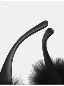 Close-up of curved sunglasses legs featuring unique black plush fur trim detail