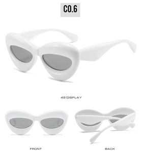 Three-angle display of white thick-frame cat-eye sunglasses with dark grey lenses