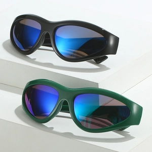 Black and green sports sunglasses with blue reflective lenses on a geometric stone display