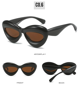 Detail view of glossy black inflated cat-eye sunglasses with brown lenses from three angles