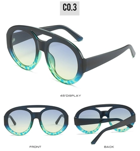 Three-angle view of oversized oval sunglasses with two-tone frames and gradient lenses