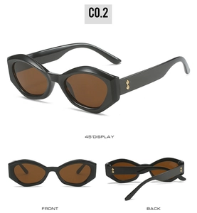 Three-angle display of black cat-eye sunglasses featuring golden diamond metal accents