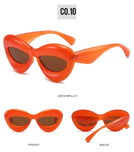 Three perspectives of trendy orange heart-shaped sunglasses with brown lenses and thick frames
