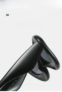 Detail of glossy black cat-eye sunglasses frame showing light and flexible material