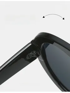 Macro detail of a durable black metal hinge on vintage-style thick frame sunglasses