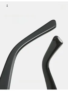 Detail of curved black glossy resin sunglass arms designed for comfortable daily wear