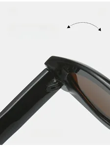 Close-up of durable metal hinge on black small frame sunglasses with smooth texture