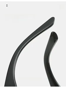 Macro detail of glossy black sunglasses with curved temple design for comfortable wear