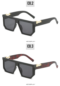 45-degree angle view of vintage square flat top sunglasses with gold metal accents