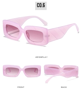 Detail of translucent pink rectangular sunglasses with embossed textured temples and gradient lens