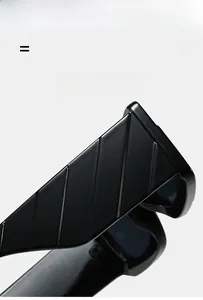 Detail of black sunglasses arm featuring iconic diagonal textured stripes and glossy finish