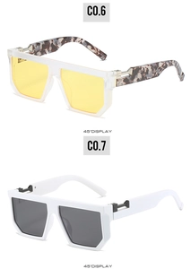 Detail view of oversized square sunglasses featuring thick temples and metal hinges