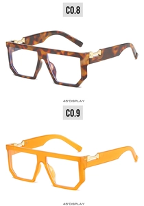 Detail view of retro square glasses frames in leopard print and translucent orange finishes