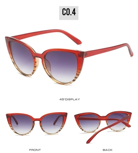 Détail de lunettes de soleil œil de chat rouge avec verres dégradés violets et monture C0.4