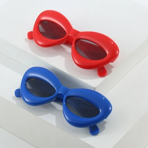 Chunky cat eye sunglasses in candy colors with thick frames and dark UV lenses
