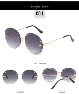 Vue détaillée de lunettes de soleil rondes sans monture avec verres dégradés violets