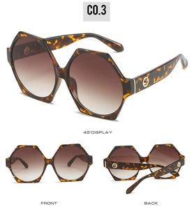 Three perspectives of oversized tortoise shell polygon sunglasses with brown gradient lenses