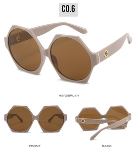 Three-view display of oversized polygon sunglasses with brown lenses and gold metal accents