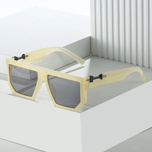 Beige oversized square sunglasses with dark grey lenses and metal hinge details