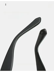 Detailed macro view of curved temples on black oversized sunglasses for comfortable fit